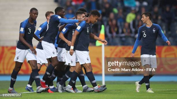 Dan Zagadou of France celebrates with his team mates after scoring his team's first goal during the 2019 FIFA U-20 World Cup group E match between...