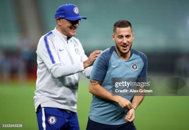 Maurizio Sarri, Manager of Chelsea jokes with Eden Hazard of Chelsea during the Chelsea FC training session on the eve of the UEFA Europa League...