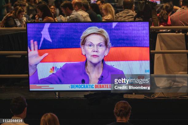 Senator Elizabeth Warren, a Democrat from Massachusetts and 2020 presidential candidate, is shown on a screen as she speaks during the Democratic...