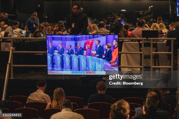 Democratic Presidential candidates are shown on a screen as they stand on stage during the Democratic presidential candidate debate in Miami,...