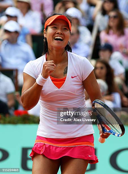 Na Li of China celebrates a point during the women's singles final match between Francesca Schiavone of Italy and Na Li of China on day fourteen of...