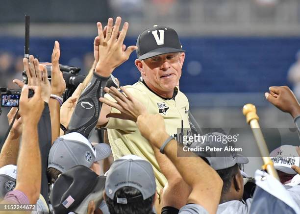Head coach Tim Corbin of the Vanderbilt Commodores celebrates after defeating the Michigan Wolverines to win the National Championship at the College...