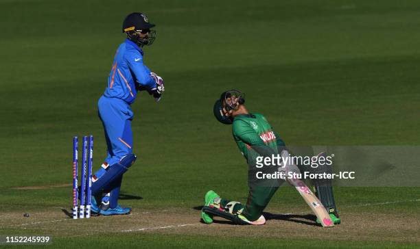 Bangladesh batsman Mushfiqur Rahim reacts after being bowled by Yadav as Rahul looks on during the ICC Cricket World Cup 2019 Warm Up match between...