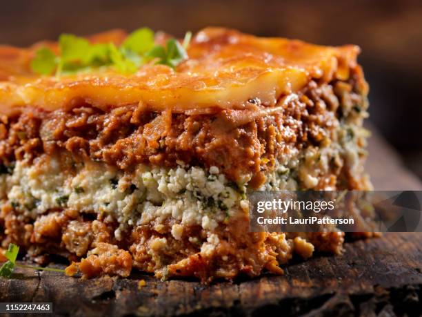 vegetarian lasagna with plant based protein meat substitute and gluten free noodles - serving lasagna stock pictures, royalty-free photos & images