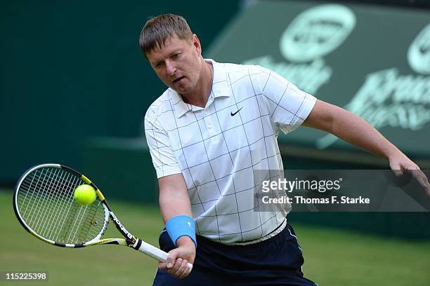 Yevgeny Kafelnikov plays a forehand during the Warsteiner Champions Trophy of the Gerry Weber Open at the Gerry Weber stadium on June 4, 2011 in...