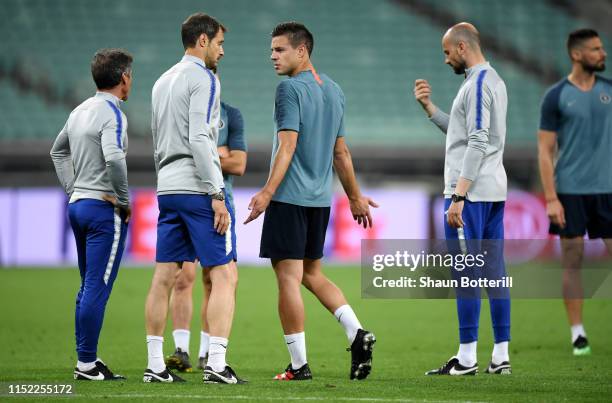 Cesar Azpilicueta and Carlo Cudicini look on during the Chelsea FC training session on the eve of the UEFA Europa League Final against Arsenal at...