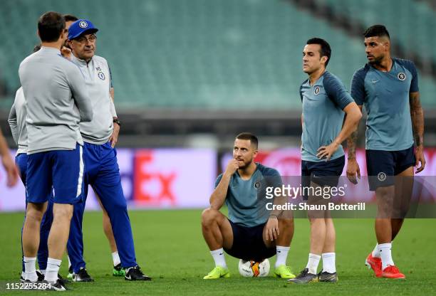 Maurizio Sarri, Manager of Chelsea, Eden Hazard, Pedro and Emerson look on during the Chelsea FC training session on the eve of the UEFA Europa...