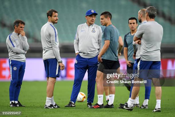 Maurizio Sarri, Manager of Chelsea looks on with Cesar Azpilicueta, Gianfranco Zola and Carlo Cudicini during the Chelsea FC training session on the...