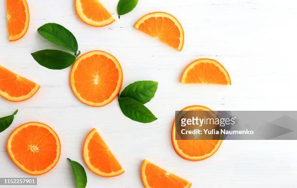 slices of orange on white background. flat lay, top view. - tangerine stock pictures, royalty-free photos & images