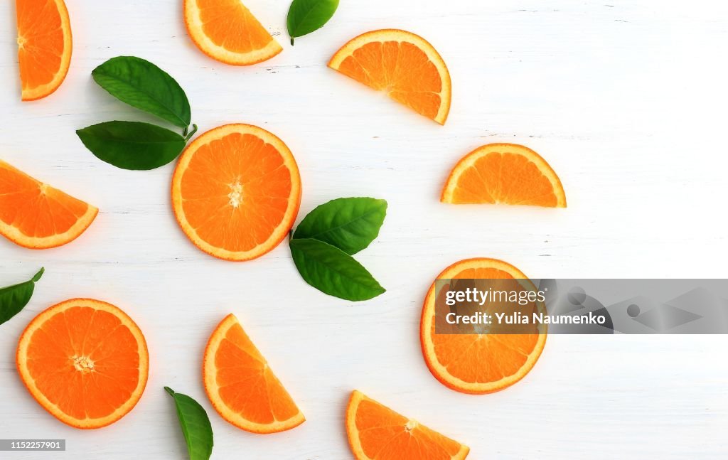 Slices of orange on white background. Flat lay, top view.