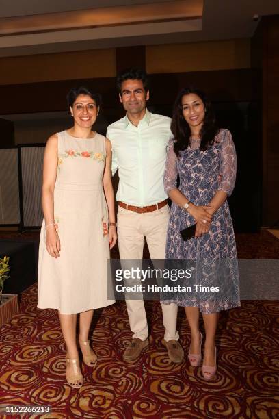 Former Indian cricketer Mohammad Kaif with former Indian woMen cricketer Anjum Chopra and his wife Pooja Kaif, poses for a picture during the launch...