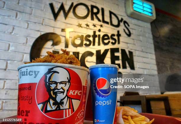 Bucket Chicken at an outlet in City Center shopping mall. KFC, also known as Kentucky Fried Chicken is an American Fast Food Company that provides...
