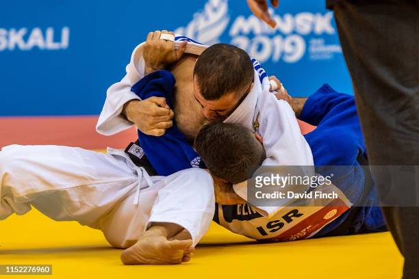 Former European champion, Amiran Papinashvili of Georgia holds Daniel Ben David of Israel for an ippon on his way to the u60kg bronze medal during...