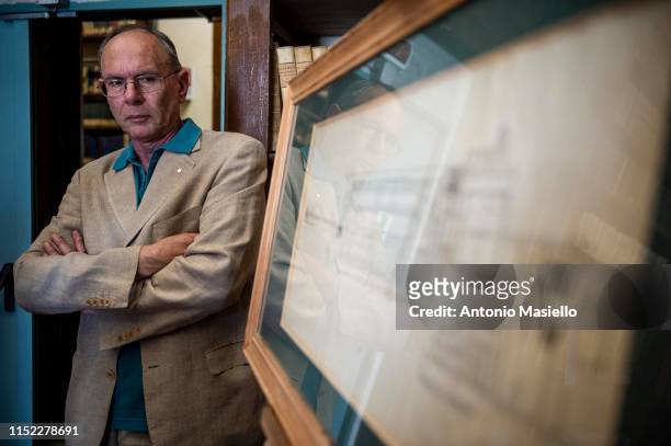 Fabrizio Diozzi, Conservator and Librarian of the "Officina dei Papiri Ercolanesi" shows a map at the National Library of Naples, on June 27, 2019 in...