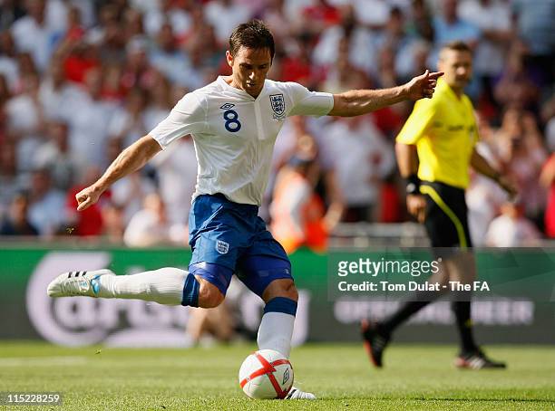 Frank Lampard of England scores their first goal from the penalty spot during the UEFA EURO 2012 Group G qualifying match between England and...