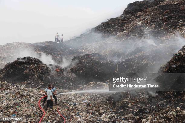 Major fire broke out at Adharwadi dumping ground on Wednesday, enveloping the area with a thick cloud of smoke, on June 26, 2019 in Mumbai, India....