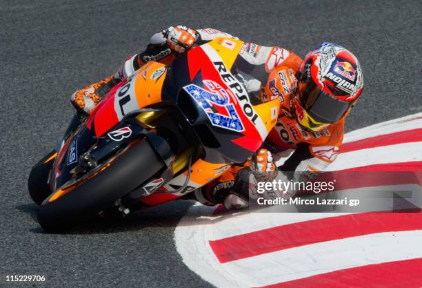 Casey Stoner of Australia and Repsol Honda Team rounds the bend during the qualifying practice of MotoGp Of Catalunya at Circuit de Catalunya on June...