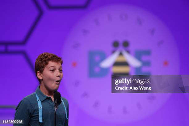 Guy Peretz of Plantation, Florida, reacts after correctly spelling his word during round three of the Scripps National Spelling Bee at the Gaylord...