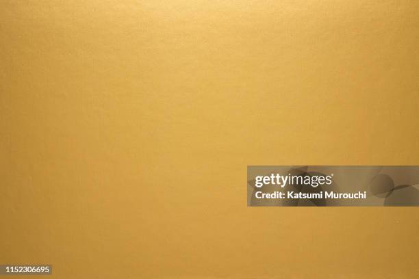 sleek gold paper texture background - gold stock pictures, royalty-free photos & images