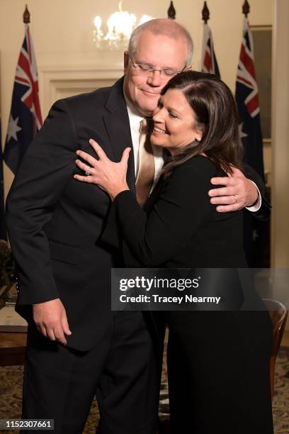 Prime Minister Scott Morrison and his wife Jenny Morrison embrace during the swearing-in ceremony at Government House on May 29, 2019 in Canberra,...