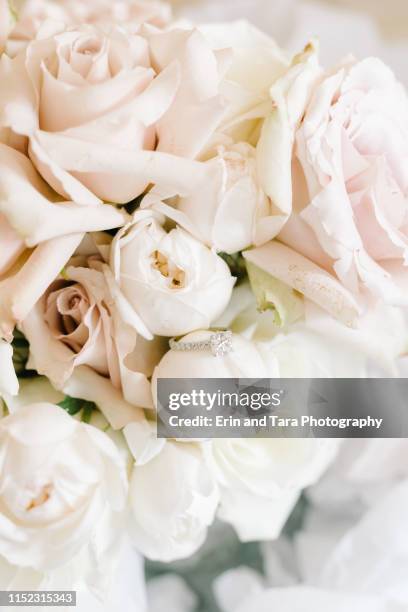 beautiful diamond wedding ring submerged in bouquet - wedding flowers stock pictures, royalty-free photos & images