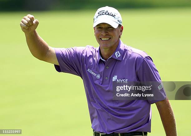 Steve Stricker celebrates after holing out for an eagle 2 on the par 4 2nd hole during the third round of the Memorial Tournament presented by...