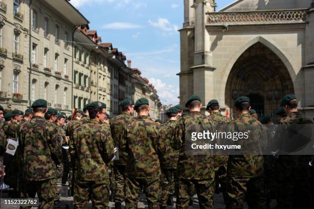 swiss military music members training in bern - walking festival soldier stock pictures, royalty-free photos & images