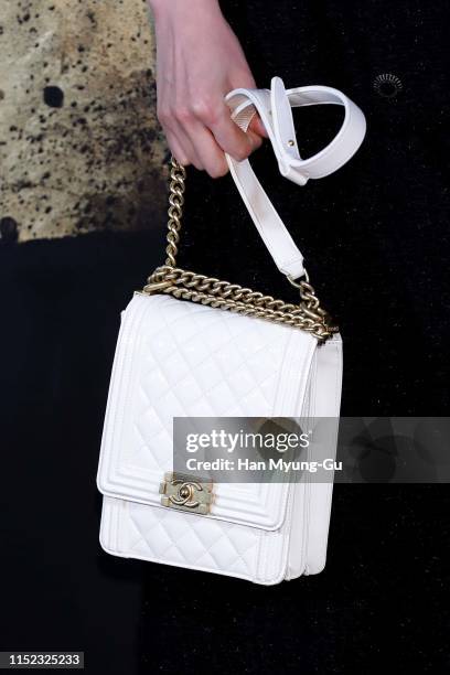 South Korean actress Lee Sung-Kyung, bag detail, attends the CHANEL Paris-New York 2018'19 Metiers d'Art show on May 28, 2019 in Seoul, South Korea.