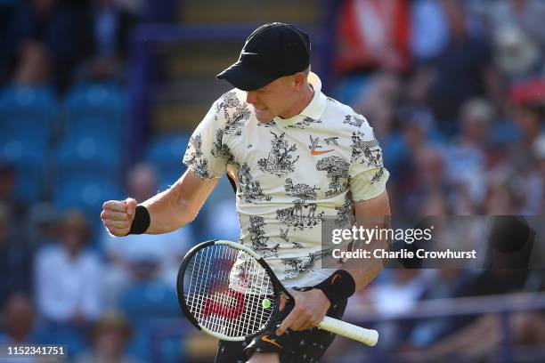 Kyle Edmund of Great Britain celebrates winning his men's singles quarter-final match against Daniel Evans of Great Britain during day four of the...