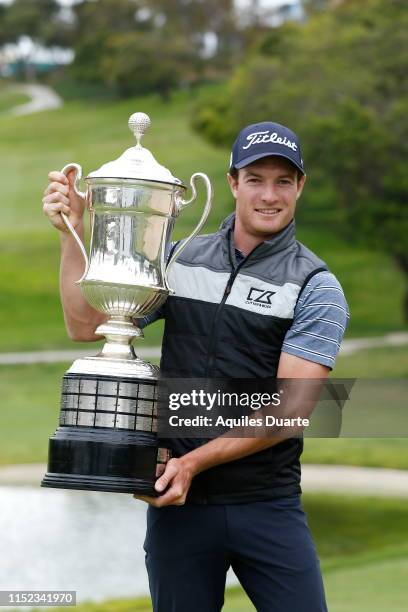 Drew Nesbitt of Canada holds the trophy after the final round of the PGA TOUR Latinoamerica 60º Abierto Mexicano de Golf at Club Campestre Tijuana on...