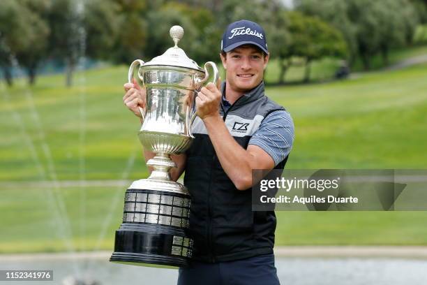 Drew Nesbitt of Canada holds the trophy after the final round of the PGA TOUR Latinoamerica 60º Abierto Mexicano de Golf at Club Campestre Tijuana on...
