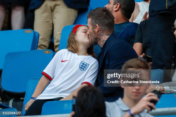 David Beckham kisses his daughter Harper Beckham during the 2019 FIFA Women's World Cup France Quarter Final match between Norway and England at...