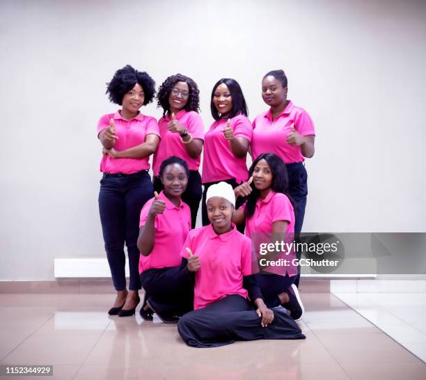 group of successful african businesswomen showing thumbs up - organized group photo stock pictures, royalty-free photos & images