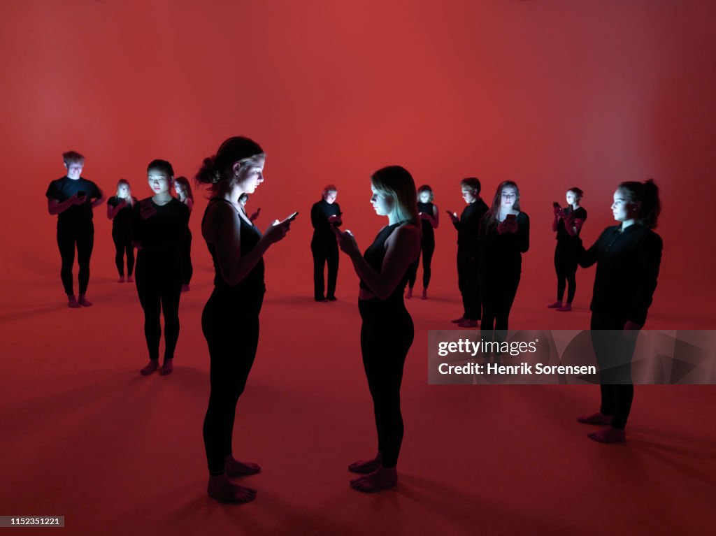 Group of people using smartphones