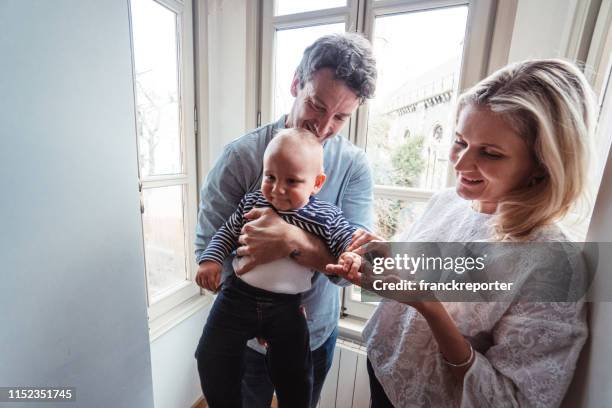 little kid with his father - woman picking up toys stock pictures, royalty-free photos & images