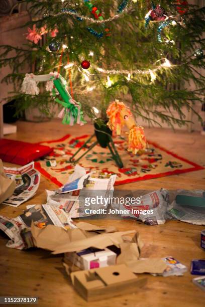 paper and boxed under christmas tree - johner christmas bildbanksfoton och bilder