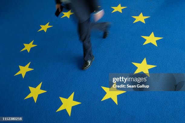 Person walks across carpeting with the flag of the European Union at the headquarters of the German Christian Democrats during European parliamentary...