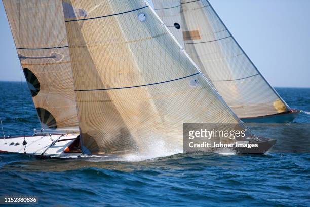 sailing boats on sea - sail boom stock-fotos und bilder