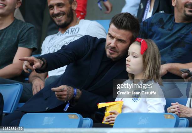 David Beckham and daughter Harper Seven Beckham attend the 2019 FIFA Women's World Cup France Quarter Final match between Norway and England at Stade...