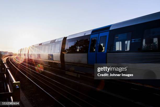 train at sunset - stockholm metro stock pictures, royalty-free photos & images