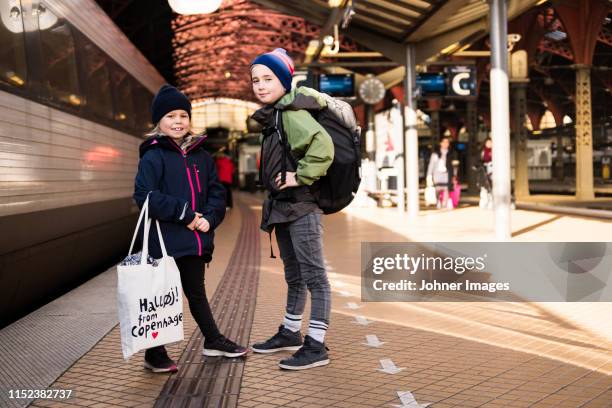 brother and sister on train platform - train denmark stock pictures, royalty-free photos & images