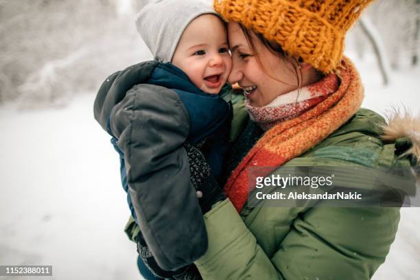 baby's first snow - winter baby stock pictures, royalty-free photos & images