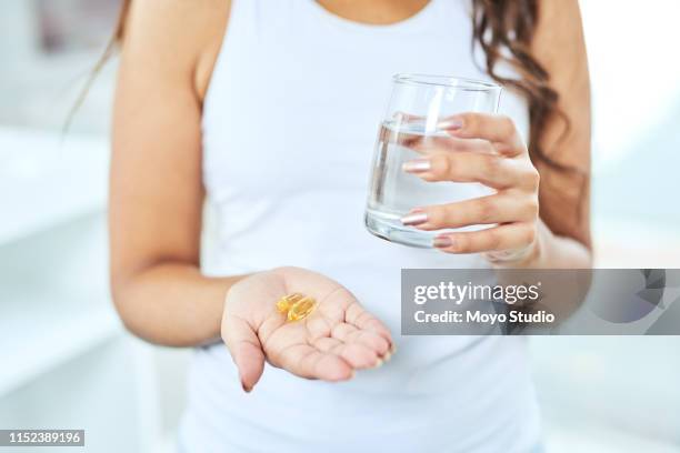 do whatever is best for your health - fish oil stock pictures, royalty-free photos & images