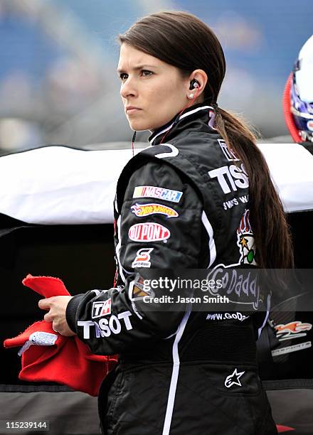 Danica Patrick, driver of the Tissot/GoDaddy.com, stands on the grid during qualifying for the NASCAR Nationwide Series STP 300 at Chicagoland...