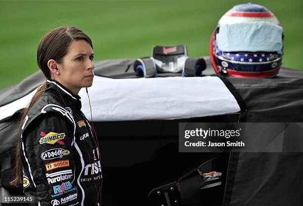 Danica Patrick, driver of the Tissot/GoDaddy.com, stands on the grid during qualifying for the NASCAR Nationwide Series STP 300 at Chicagoland...