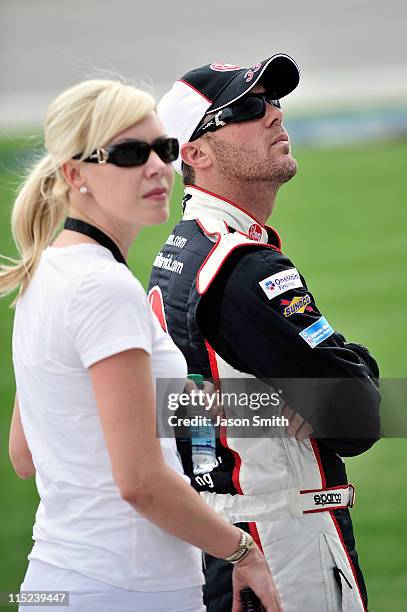 Kevin Harvick, driver of the Rheem Chevrolet, stands on the grid with wife DeLana, during qualifying for the NASCAR Nationwide Series STP 300 at...