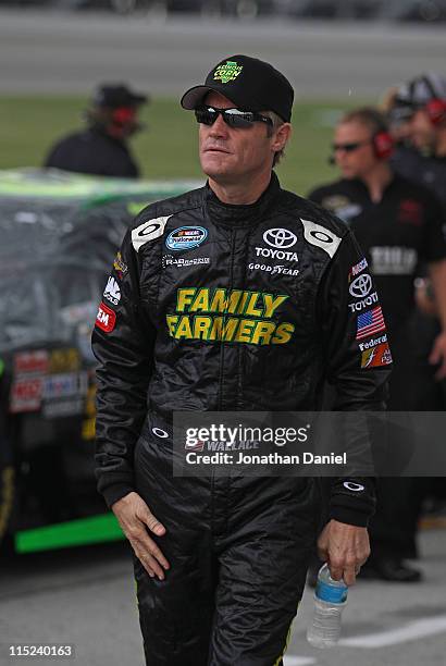 Kenny Wallace, driver of the Family Farmers/Marquis Energy Toyota, waits to qualify for the NASCAR Nationwide STP 300 at Chicagoland Speedway on June...