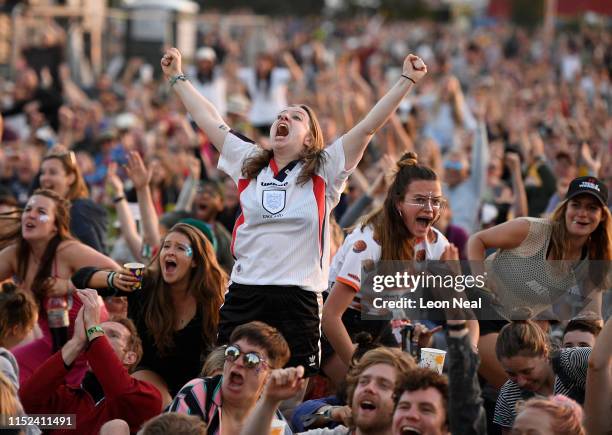 England fans react as they watch England's victory over Norway in the 2019 FIFA Women's World Cup quarter-finals on the West Holts stage during day...