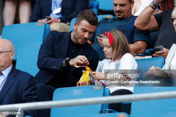 David Beckham and his daughter Harper Beckham enjoy the atmosphere during the 2019 FIFA Women's World Cup France Quarter Final match between Norway...