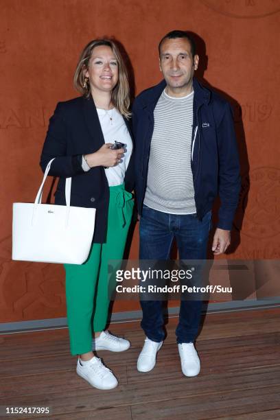 Caroline Fraindt and Zinedine Soualem attend the 2019 French Tennis Open - Day Four at Roland Garros on May 29, 2019 in Paris, France.